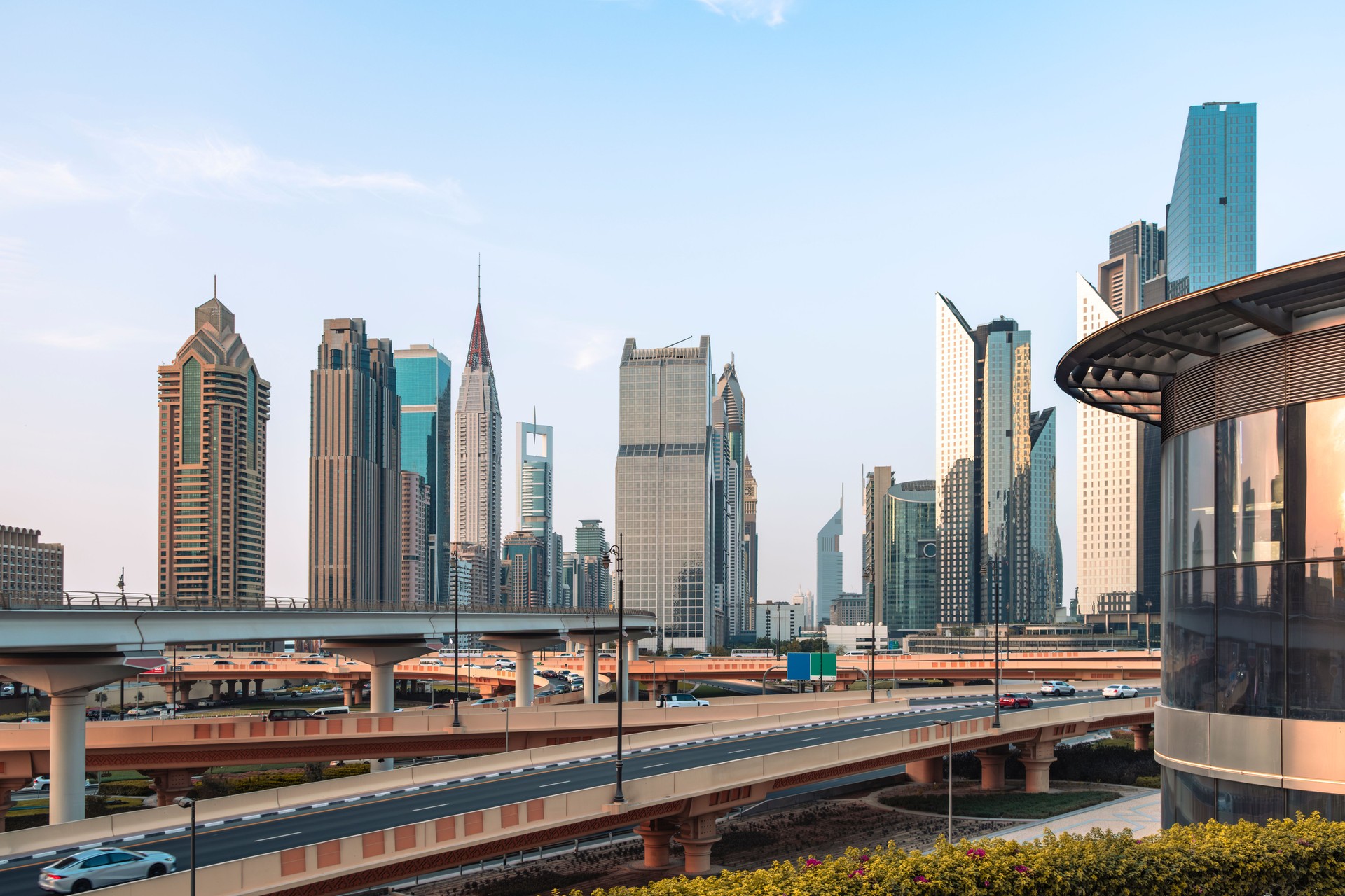 Dubai skyline panorama with metro, modern buildings, and Sheikh Zayed Road cityscape during daytime